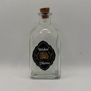Target Clear Glass Bottle with Black and Gold Wicked Thorns Label